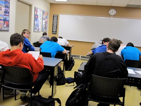 students writing in private school